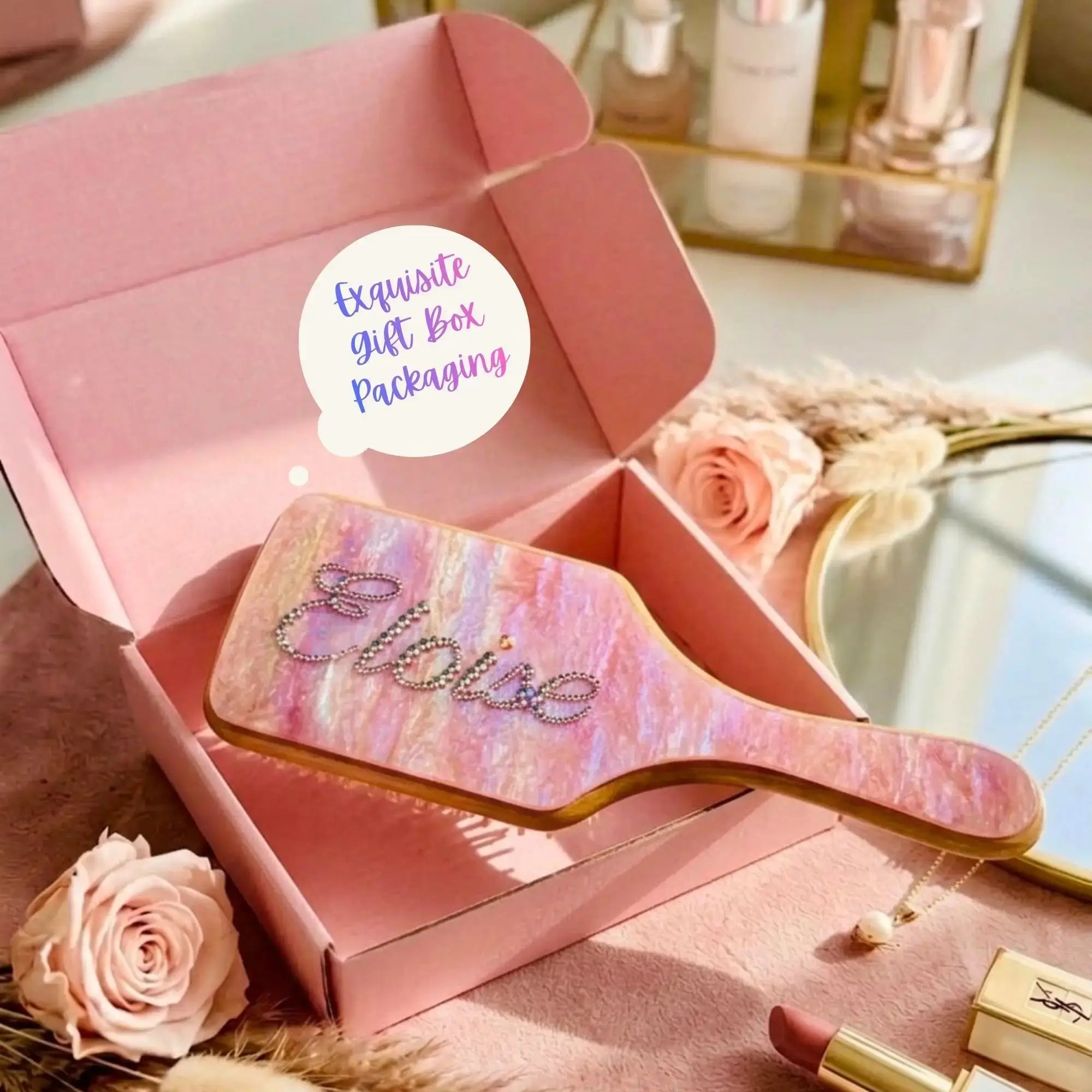 Rhinestone air cushion hair brush in a gift box with pink marbled cushion and wooden handle