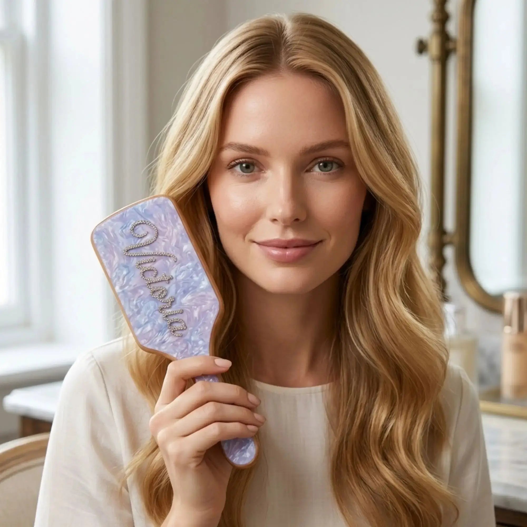 Rhinestone hair brush with light blue embellished pad and engraved rhinestone name