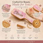 Pink air-cushion hair brush with clear rhinestone pattern and cushioned base