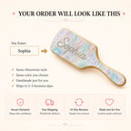 Iridescent air-cushion hair brush with rhinestone bow design and wooden handle