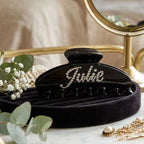 Black hair claw clip with glittery rhinestone initial detail for thick hair.