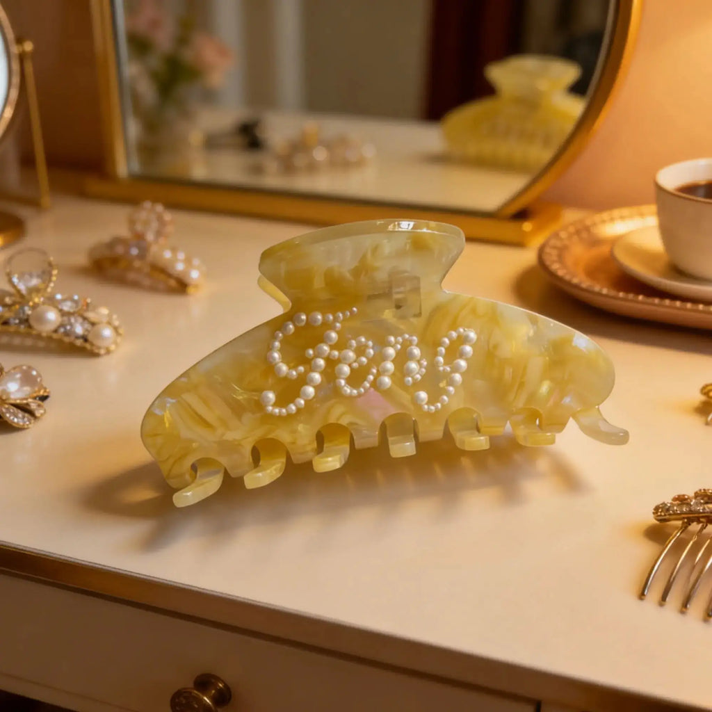 Light amber hair claw clip with white faux pearls in a pearl swirl