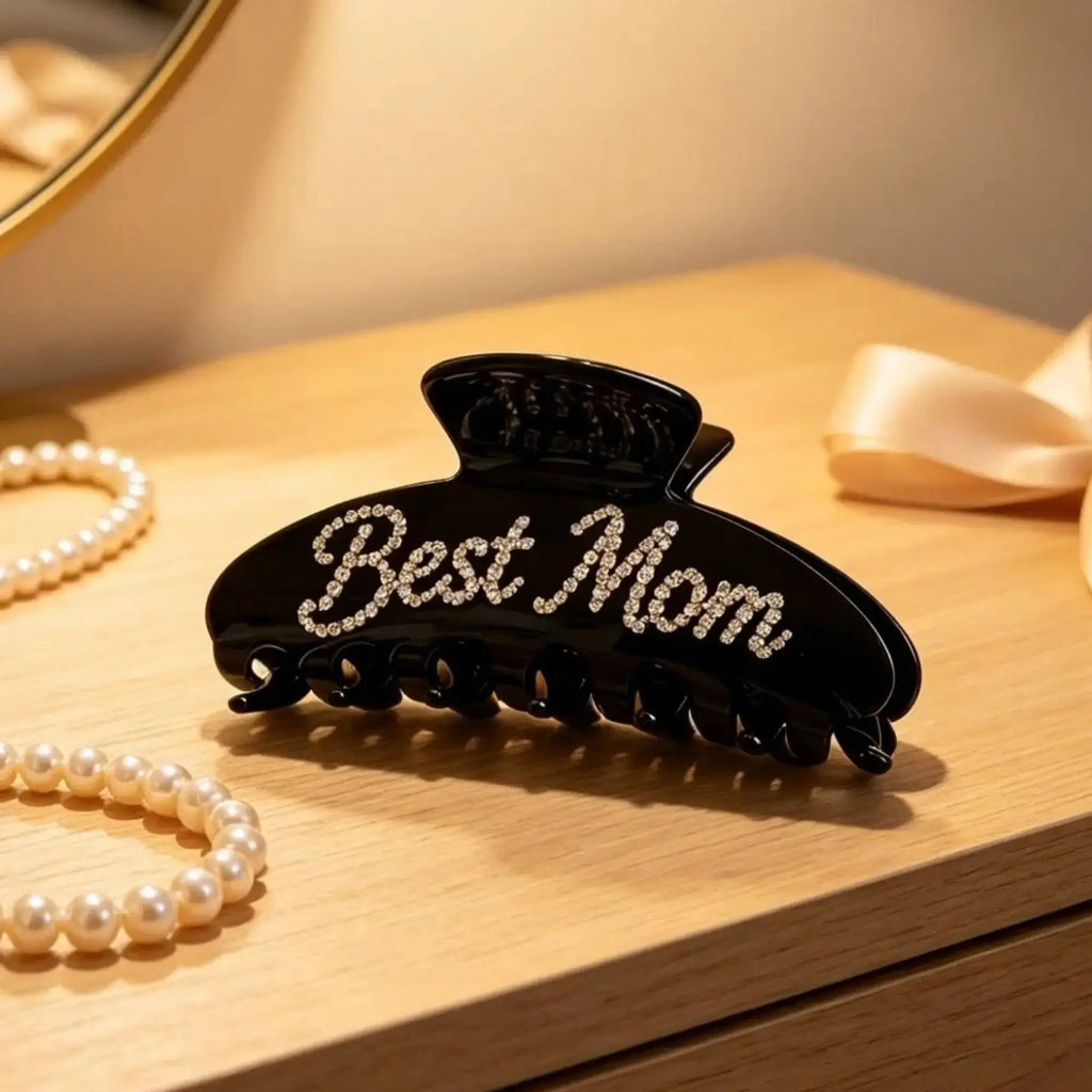 Black hair claw clip with rhinestone "Best Mom" lettering and prongs